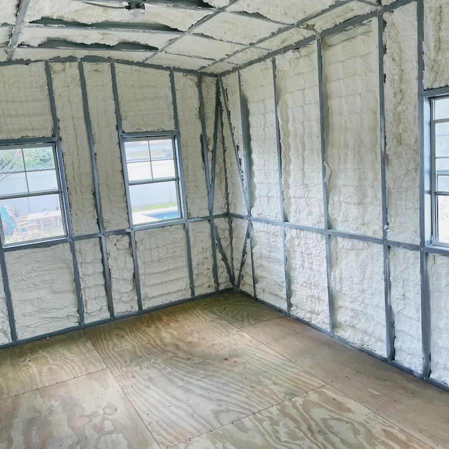 Closed-cell spray foam insulation applied to wall cavities in a residential project in Clifton Park